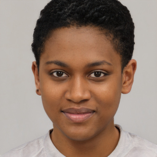 Joyful black young-adult female with short  brown hair and brown eyes