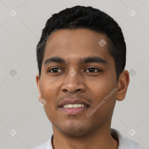 Joyful latino young-adult male with short  black hair and brown eyes