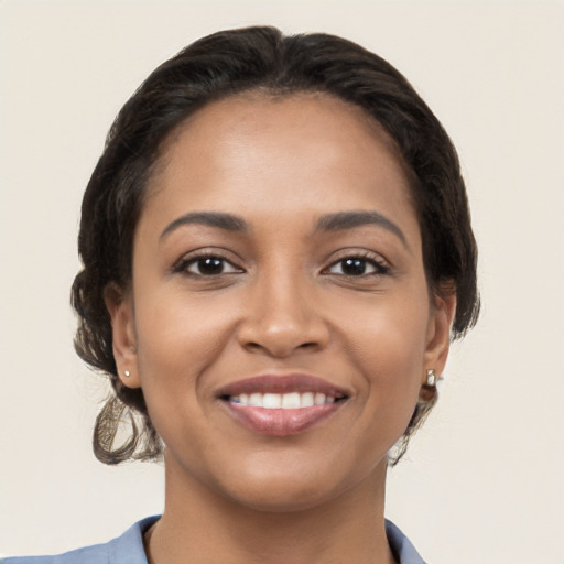 Joyful latino young-adult female with medium  brown hair and brown eyes