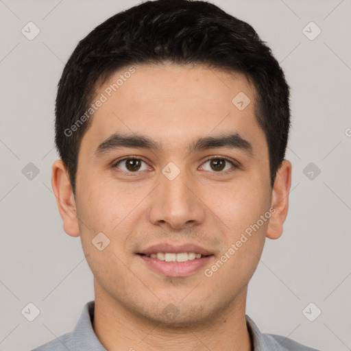 Joyful latino young-adult male with short  brown hair and brown eyes