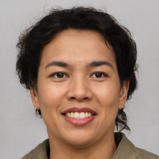 Joyful asian adult female with short  brown hair and brown eyes