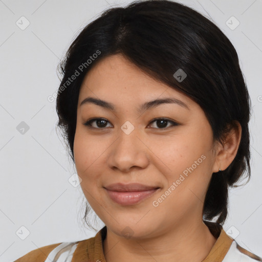 Joyful latino young-adult female with medium  brown hair and brown eyes