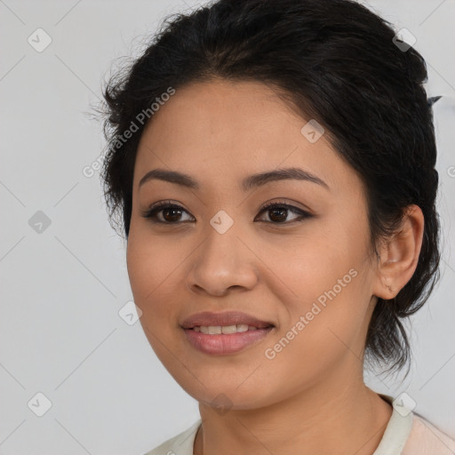 Joyful latino young-adult female with medium  brown hair and brown eyes