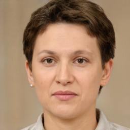 Joyful white adult female with short  brown hair and brown eyes