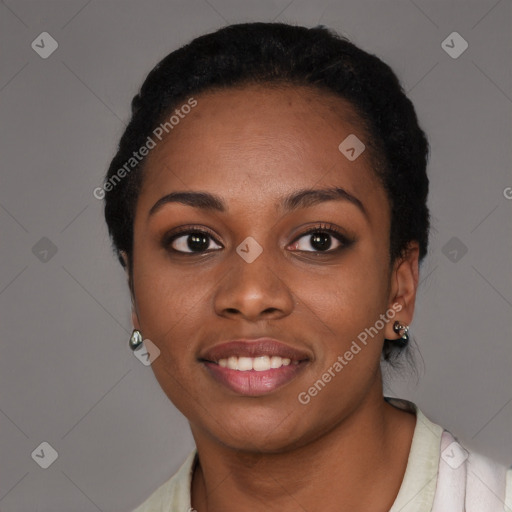 Joyful black young-adult female with short  black hair and brown eyes