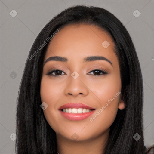 Joyful latino young-adult female with long  black hair and brown eyes