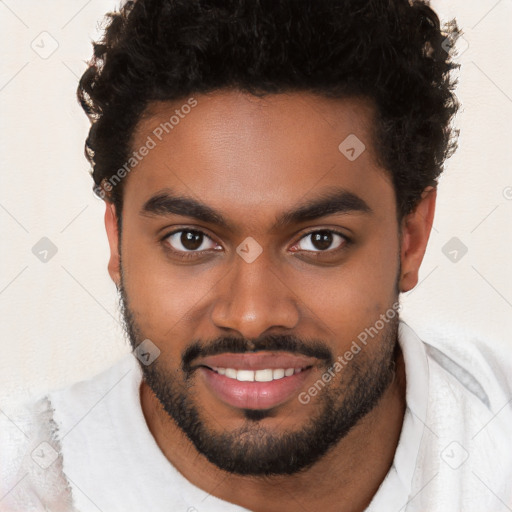 Joyful black young-adult male with short  brown hair and brown eyes