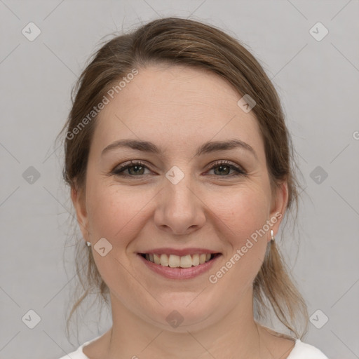 Joyful white young-adult female with medium  brown hair and grey eyes