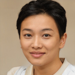 Joyful asian young-adult female with short  brown hair and brown eyes