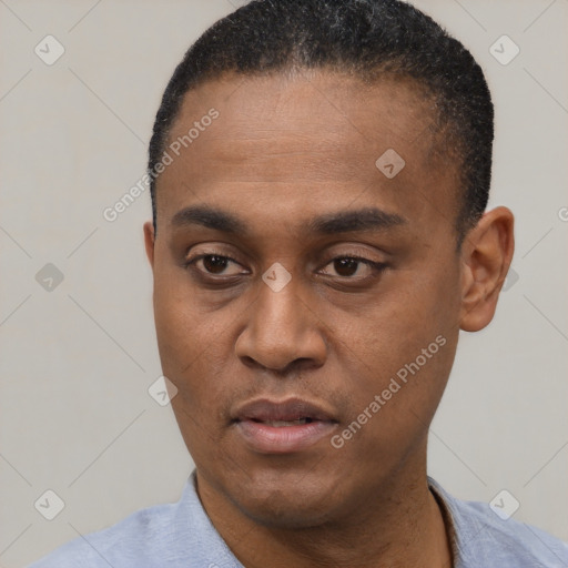 Neutral latino young-adult male with short  black hair and brown eyes