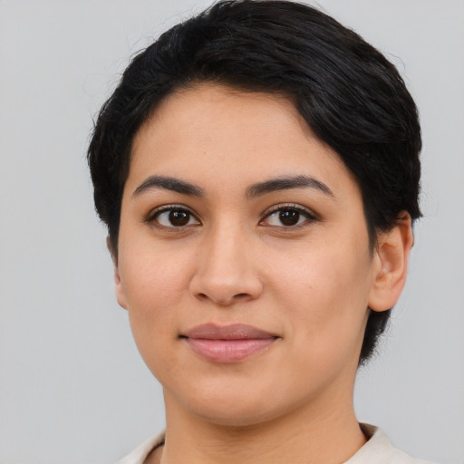 Joyful asian young-adult female with short  black hair and brown eyes