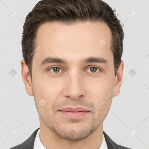 Joyful white young-adult male with short  brown hair and brown eyes