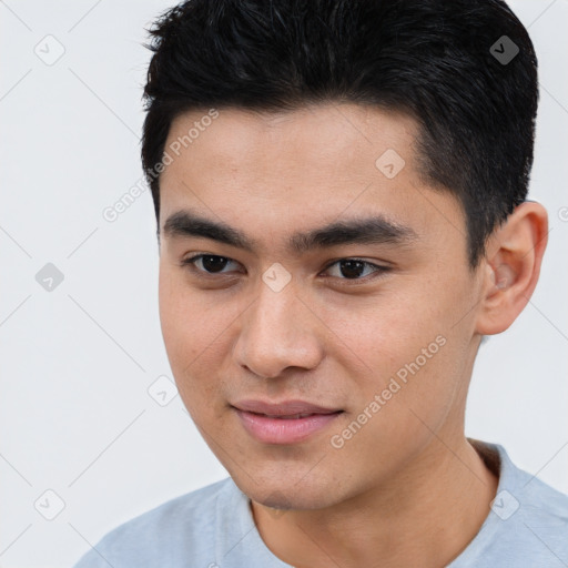 Joyful asian young-adult male with short  black hair and brown eyes