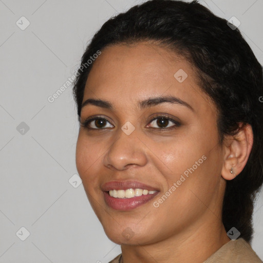 Joyful latino young-adult female with short  black hair and brown eyes