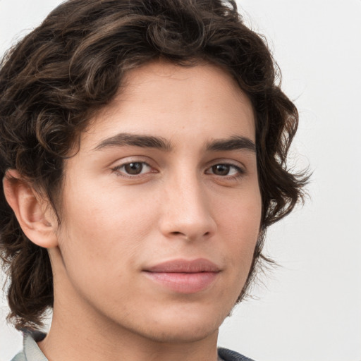 Joyful white young-adult male with medium  brown hair and brown eyes