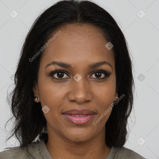 Joyful black young-adult female with long  brown hair and brown eyes