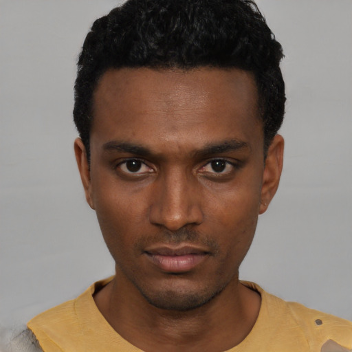 Neutral black young-adult male with short  black hair and brown eyes