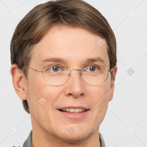 Joyful white adult male with short  brown hair and grey eyes