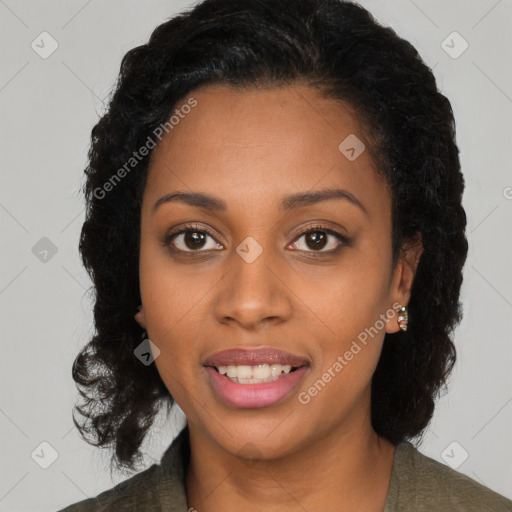 Joyful black young-adult female with long  black hair and brown eyes