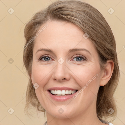 Joyful white young-adult female with medium  brown hair and grey eyes