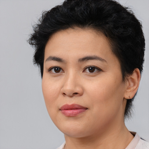 Joyful asian young-adult female with short  brown hair and brown eyes