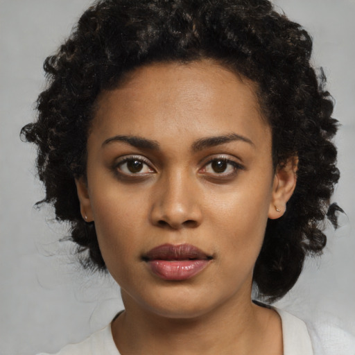 Neutral black young-adult female with medium  black hair and brown eyes