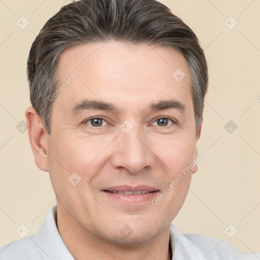 Joyful white adult male with short  brown hair and brown eyes