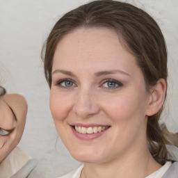 Joyful white adult female with medium  brown hair and grey eyes