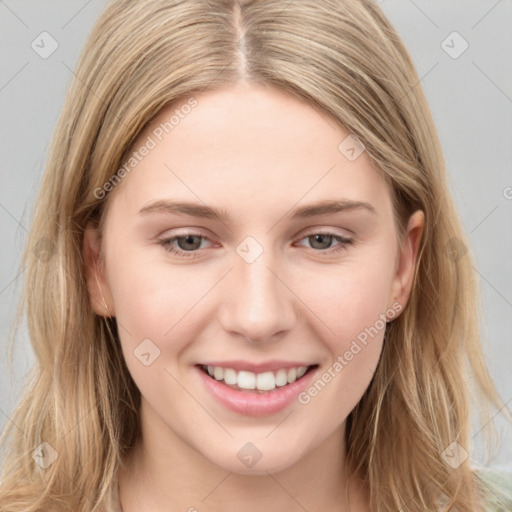 Joyful white young-adult female with long  brown hair and grey eyes