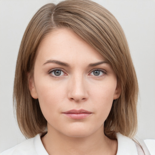 Neutral white young-adult female with medium  brown hair and grey eyes