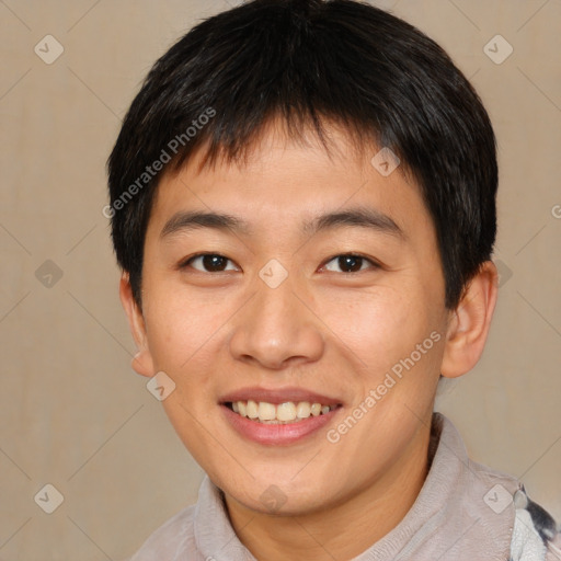 Joyful asian young-adult male with short  brown hair and brown eyes