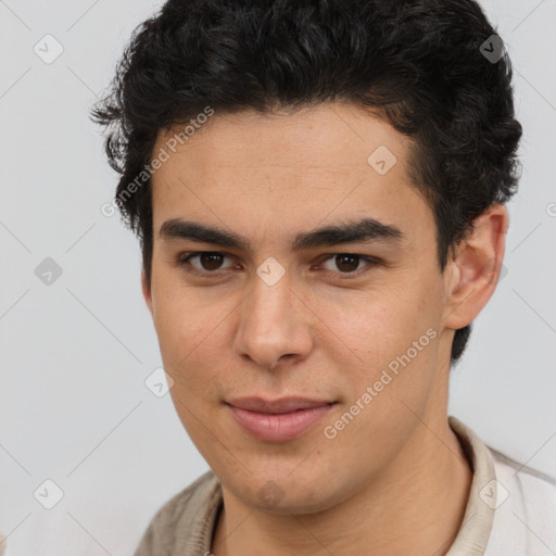 Joyful latino young-adult male with short  brown hair and brown eyes