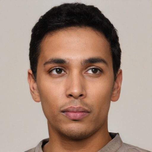 Neutral latino young-adult male with short  black hair and brown eyes