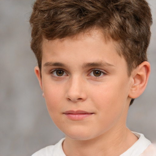 Joyful white child male with short  brown hair and brown eyes