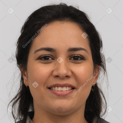 Joyful latino young-adult female with medium  brown hair and brown eyes