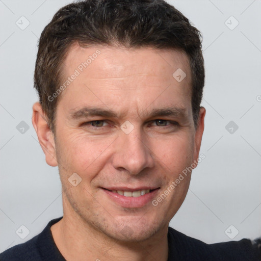 Joyful white adult male with short  brown hair and grey eyes