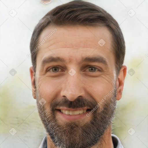 Joyful white adult male with short  brown hair and brown eyes