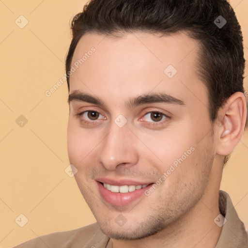 Joyful white young-adult male with short  brown hair and brown eyes