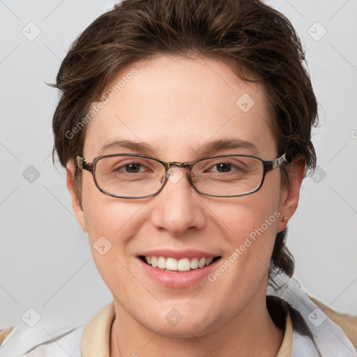 Joyful white adult female with short  brown hair and grey eyes