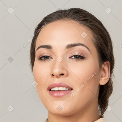 Joyful white young-adult female with medium  brown hair and brown eyes