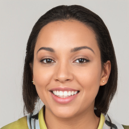 Joyful white young-adult female with medium  brown hair and brown eyes