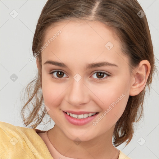 Joyful white child female with medium  brown hair and brown eyes