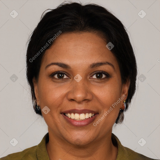 Joyful latino adult female with medium  brown hair and brown eyes