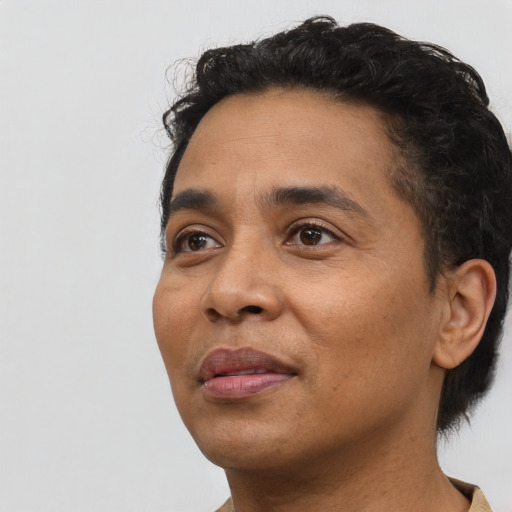 Neutral latino adult male with short  black hair and brown eyes