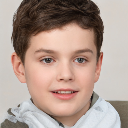 Joyful white child male with short  brown hair and brown eyes