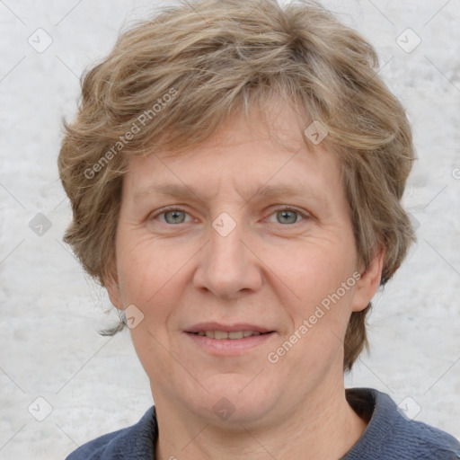 Joyful white adult female with medium  brown hair and blue eyes