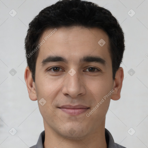 Joyful latino young-adult male with short  black hair and brown eyes