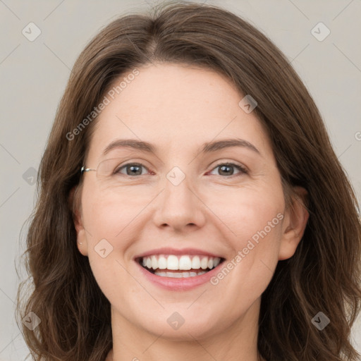 Joyful white young-adult female with long  brown hair and grey eyes