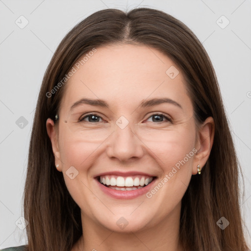 Joyful white adult female with long  brown hair and grey eyes