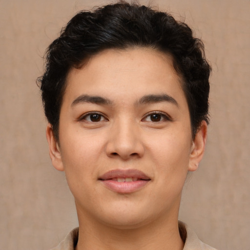 Joyful latino young-adult female with short  brown hair and brown eyes